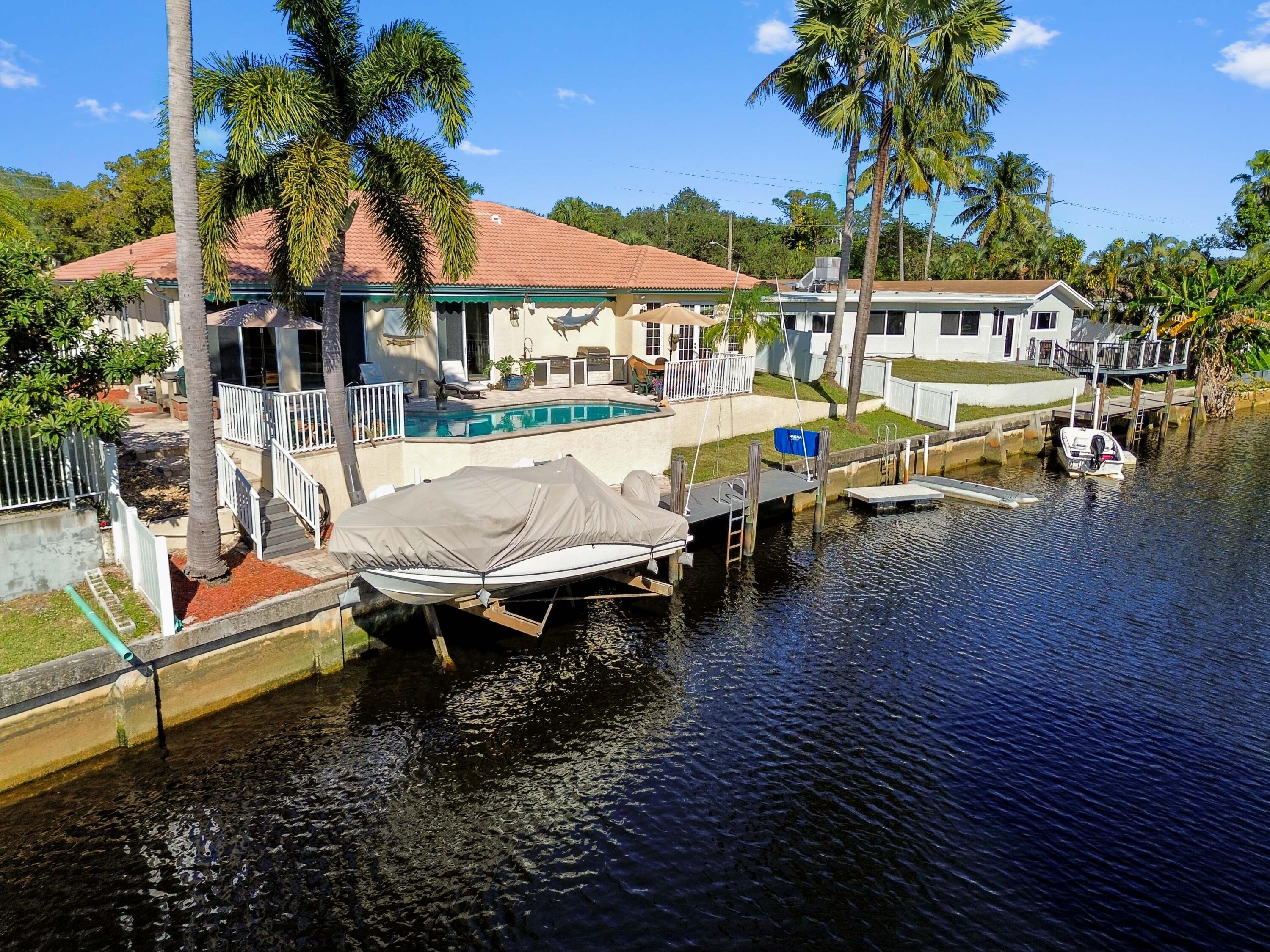746 West Palmetto Park Road Boca Raton, FL 33486 - Photo 48 of 60 a view of a patio with swimming pool table and chairs