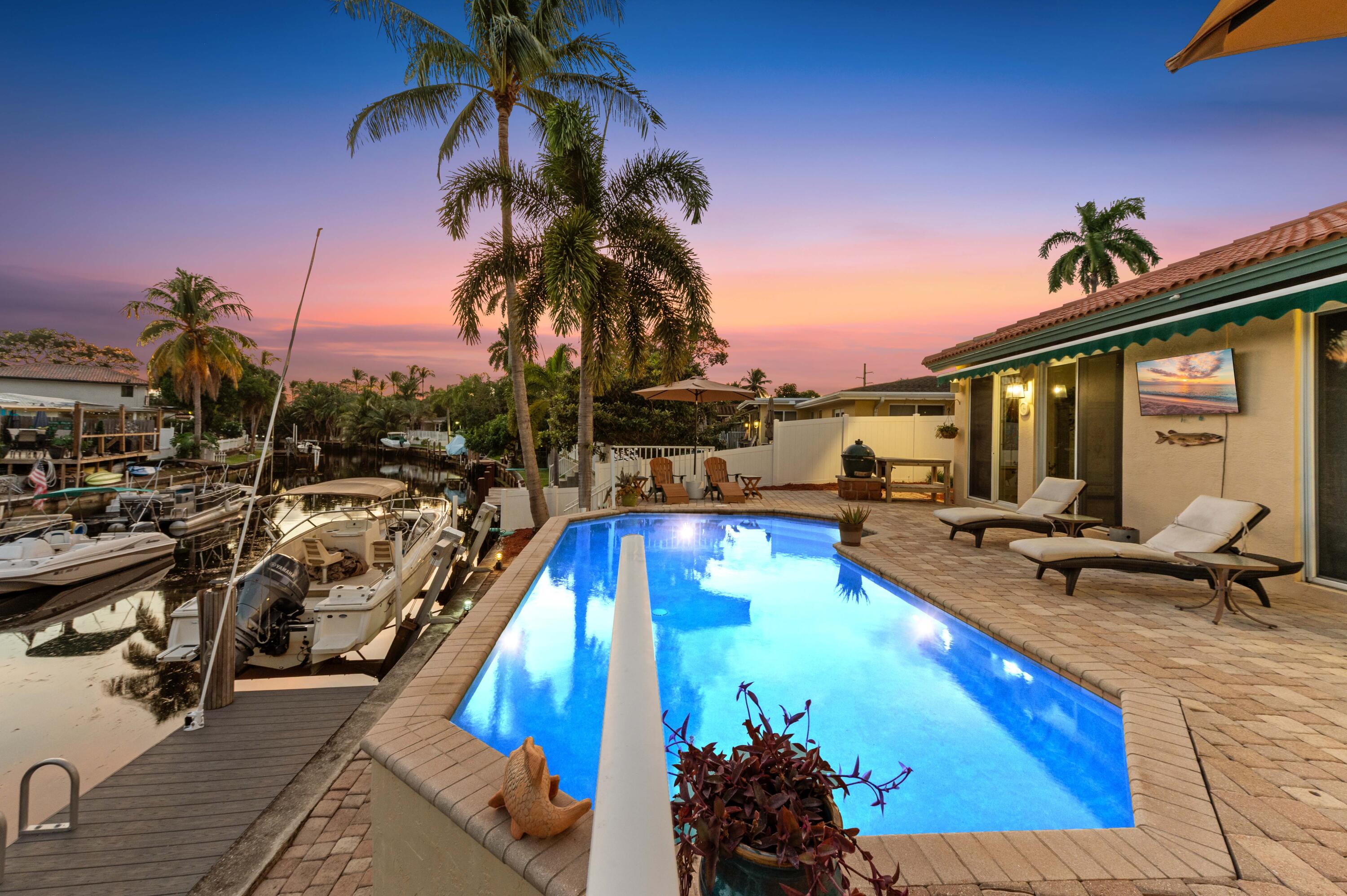 746 West Palmetto Park Road Boca Raton, FL 33486 - Photo 7 of 60 a view of a swimming pool with lounge chair