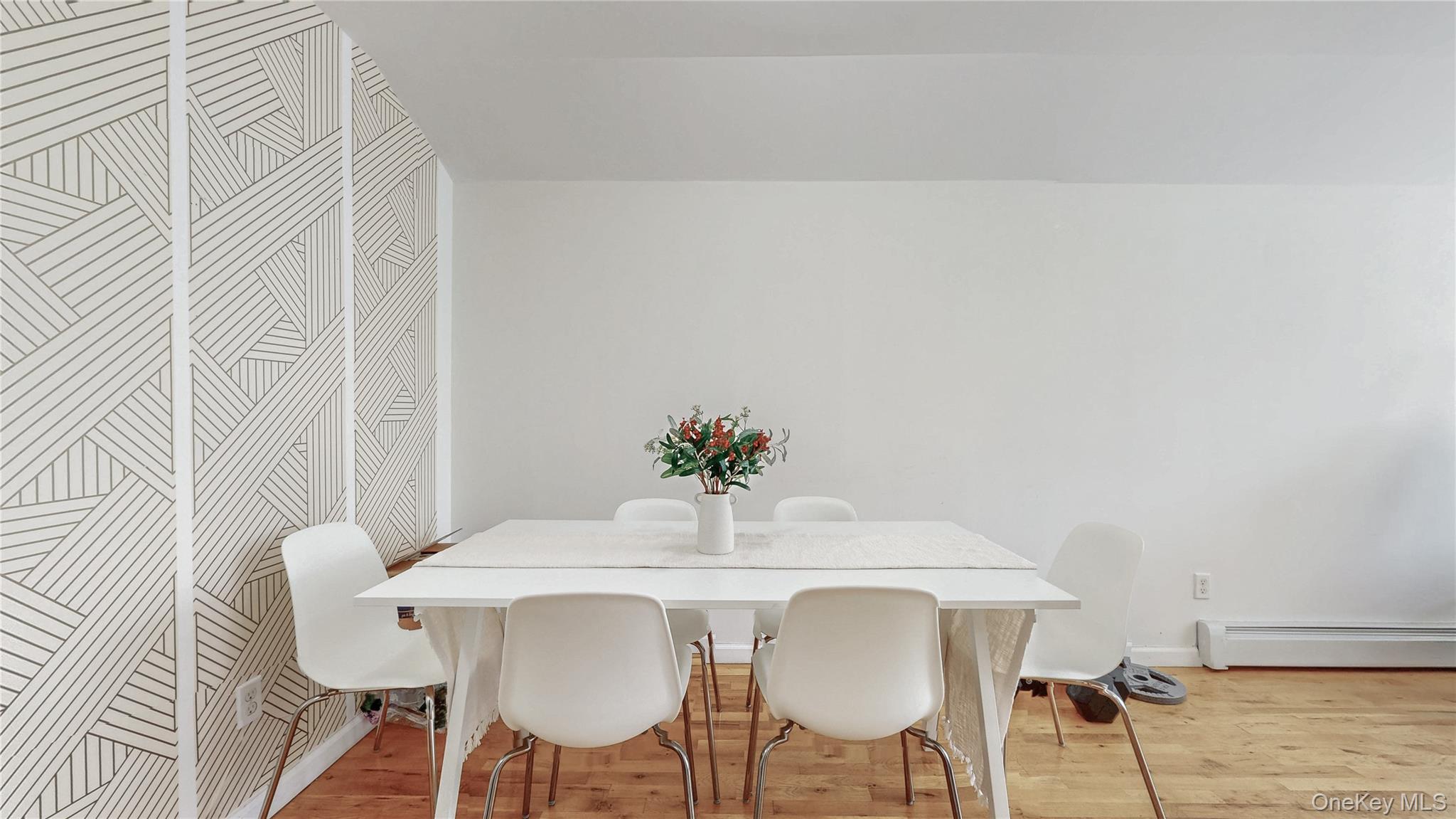 150-55 14th Road Queens, NY 11357 - Photo 11 of 39 a view of a dining room with furniture and wooden floor