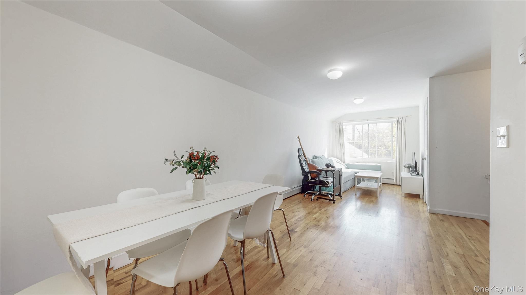150-55 14th Road Queens, NY 11357 - Photo 13 of 39 a view of a dining room with furniture and wooden floor