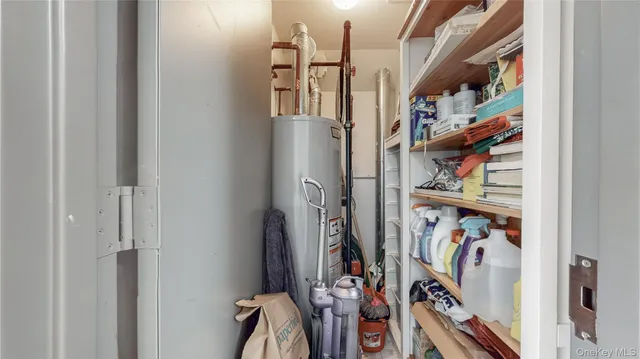 a view of walk in closet with clothes