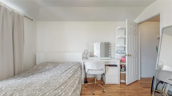 a bedroom with a bed and a table in it
