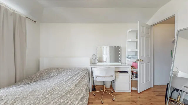 a bedroom with a bed and a table in it