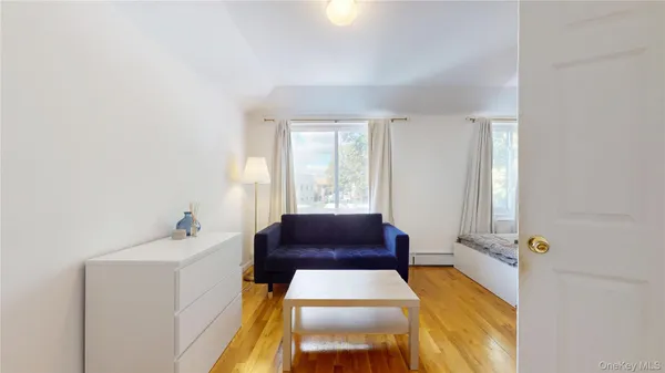 a bathroom with a tub sink and window