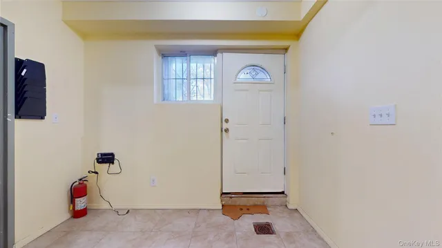 a view of storage and utility room with two washing machine