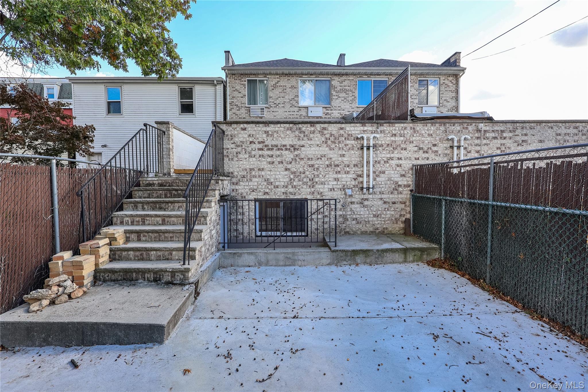 150-55 14th Road Queens, NY 11357 - Photo 32 of 39 a front view of a house with a garden