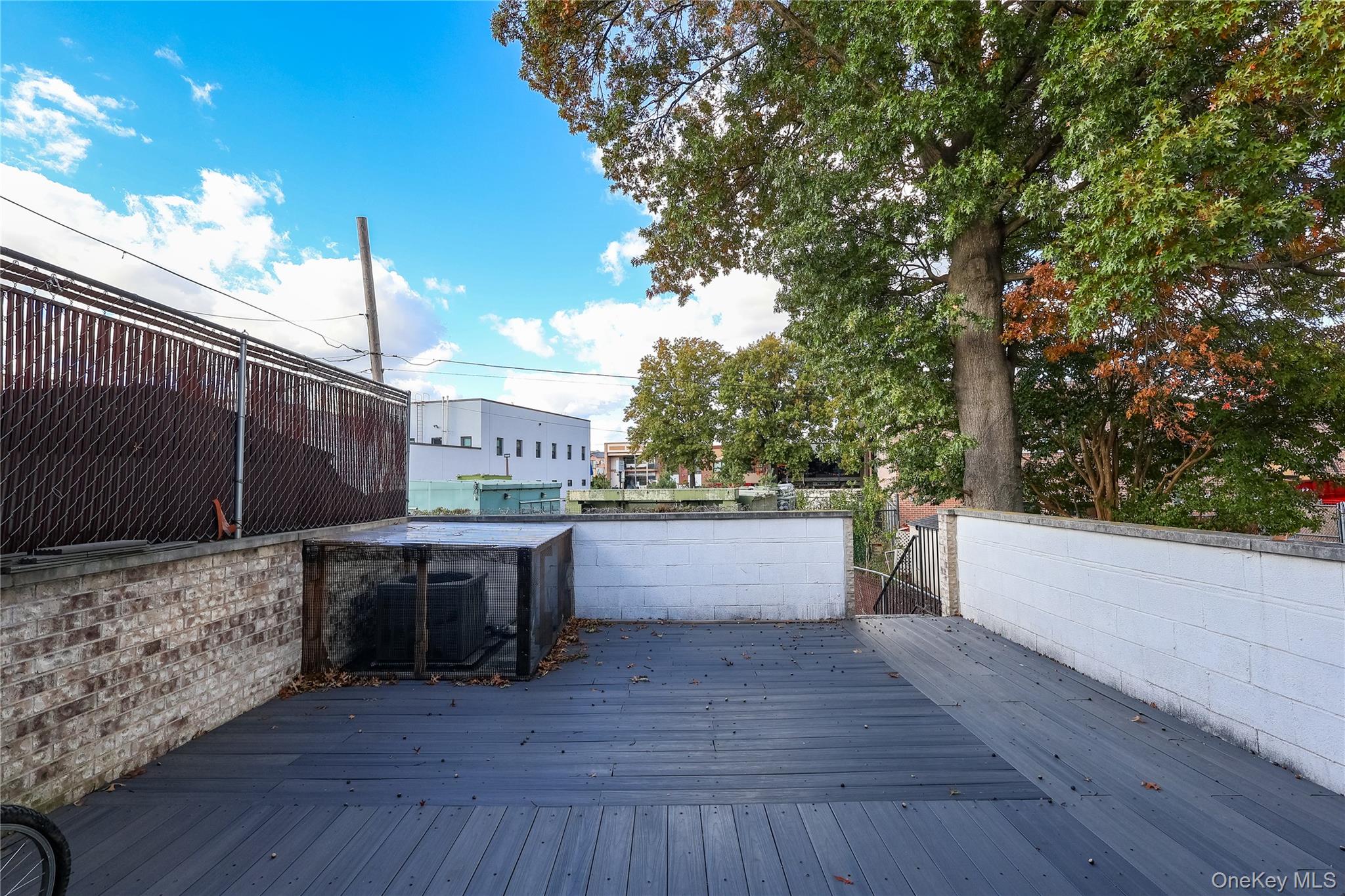 150-55 14th Road Queens, NY 11357 - Photo 34 of 39 a view of a chairs and tables in the backyard