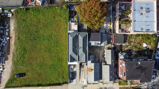 an aerial view of a house with roof deck and furniture