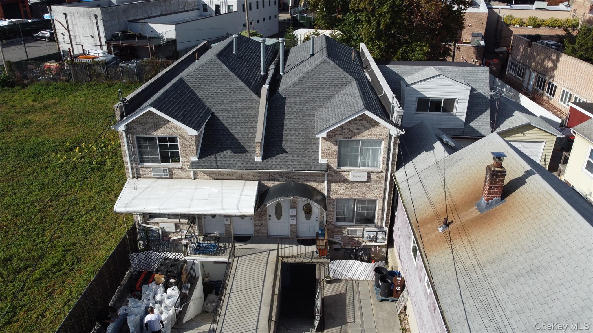 150-55 14th Road Queens, NY 11357 - Photo 38 of 39 an aerial view of a house with roof deck and furniture