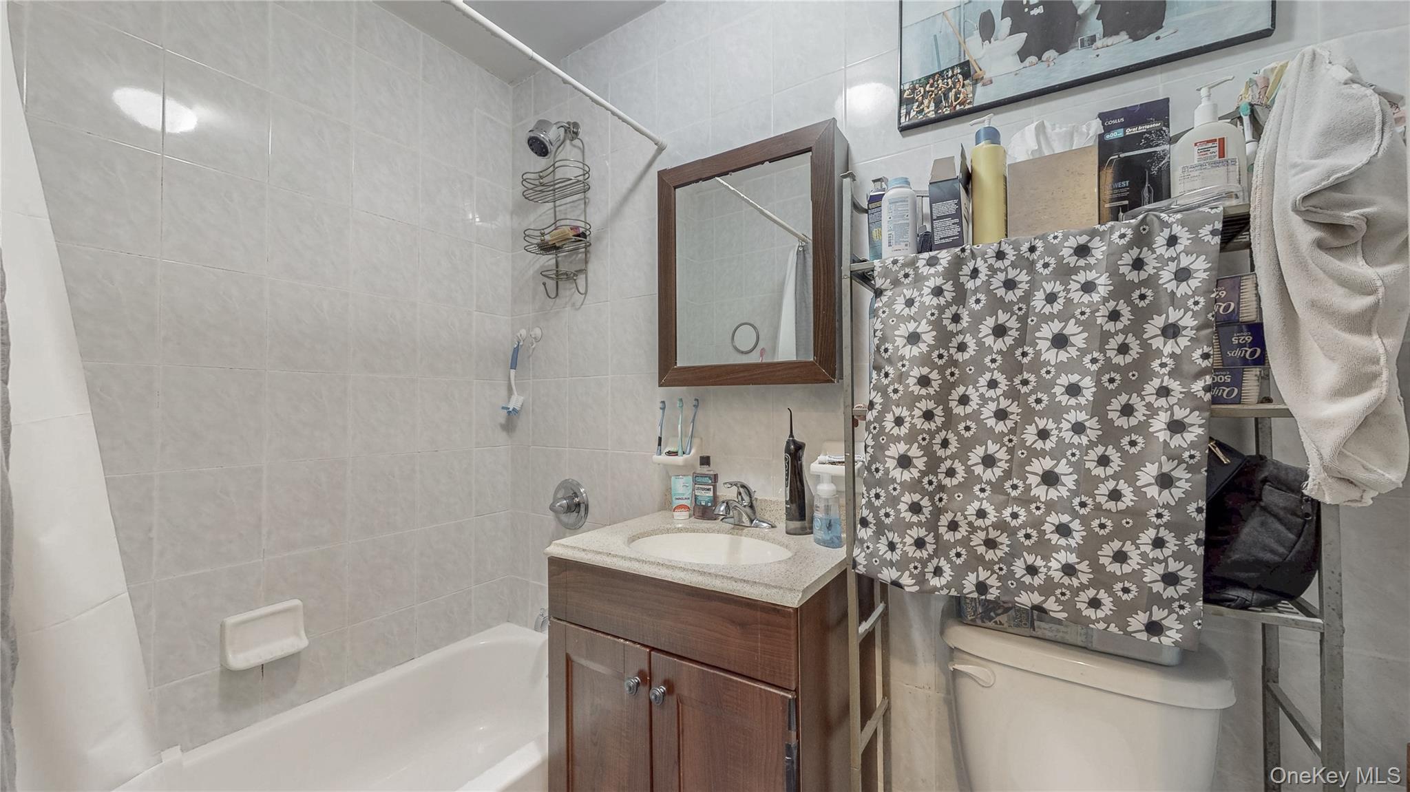150-55 14th Road Queens, NY 11357 - Photo 6 of 39 a bathroom with a sink toilet and shower