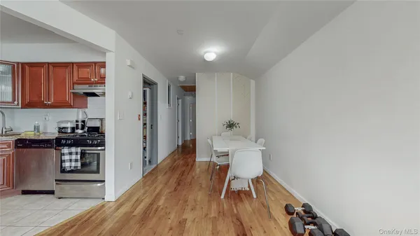 a view of a kitchen with wooden floor and a sink