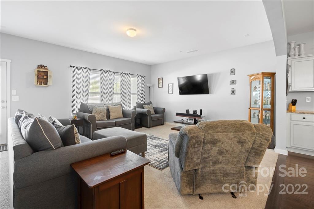 8218 Midas Lane Locust, NC 28097 - Photo 11 of 34 a living room with furniture and a flat screen tv