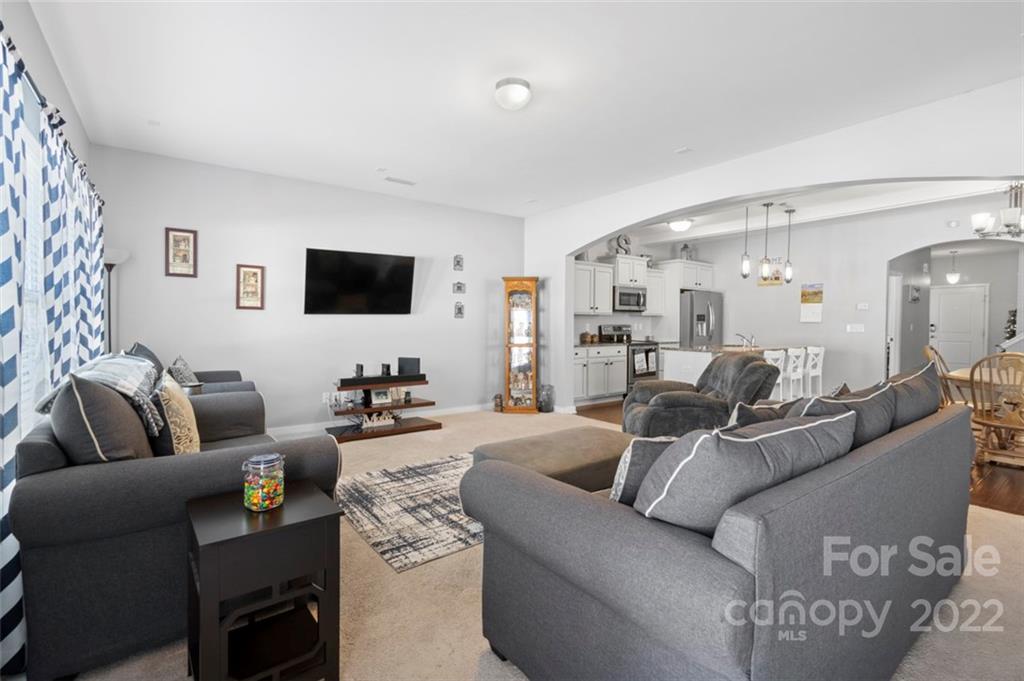8218 Midas Lane Locust, NC 28097 - Photo 12 of 34 a living room with furniture and a flat screen tv