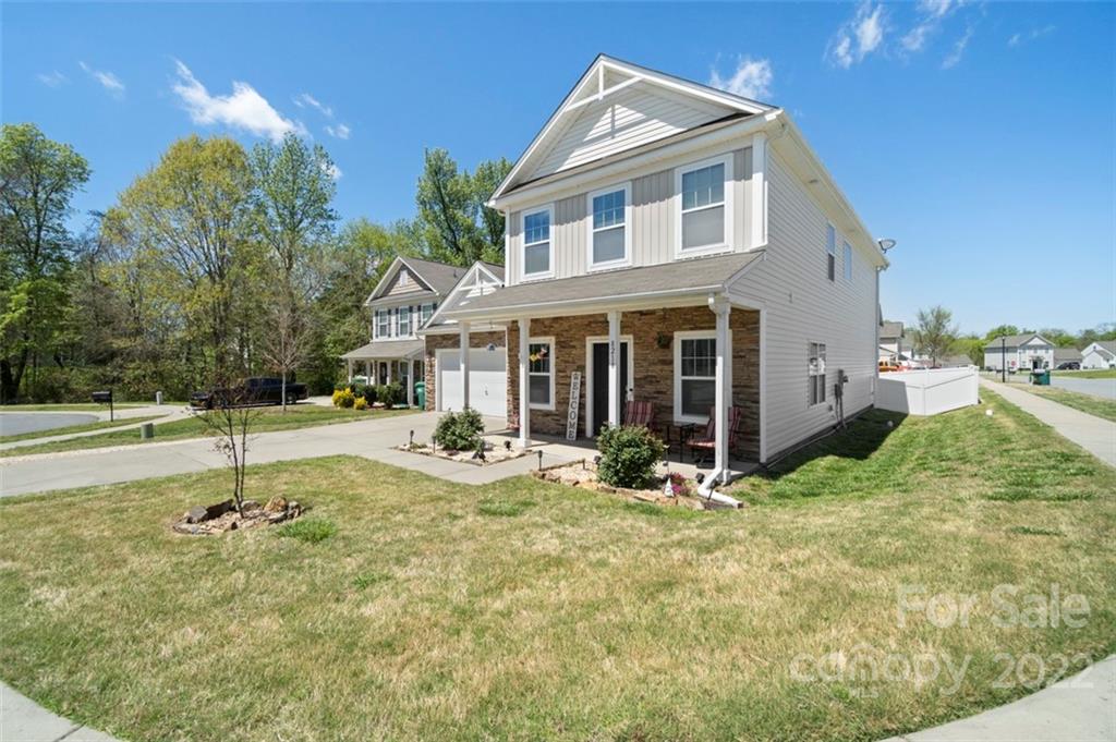 8218 Midas Lane Locust, NC 28097 - Photo 2 of 34 a view of a house with backyard and sitting area