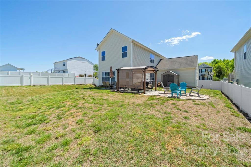 8218 Midas Lane Locust, NC 28097 - Photo 31 of 34 a swimming pool view with a outdoor seating