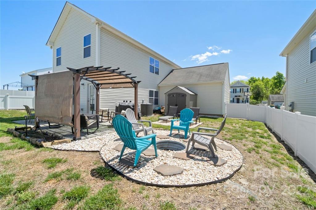8218 Midas Lane Locust, NC 28097 - Photo 32 of 34 a swimming pool with outdoor seating