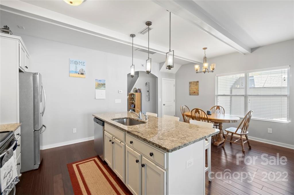 8218 Midas Lane Locust, NC 28097 - Photo 7 of 34 a kitchen that has a table chairs and wooden floor