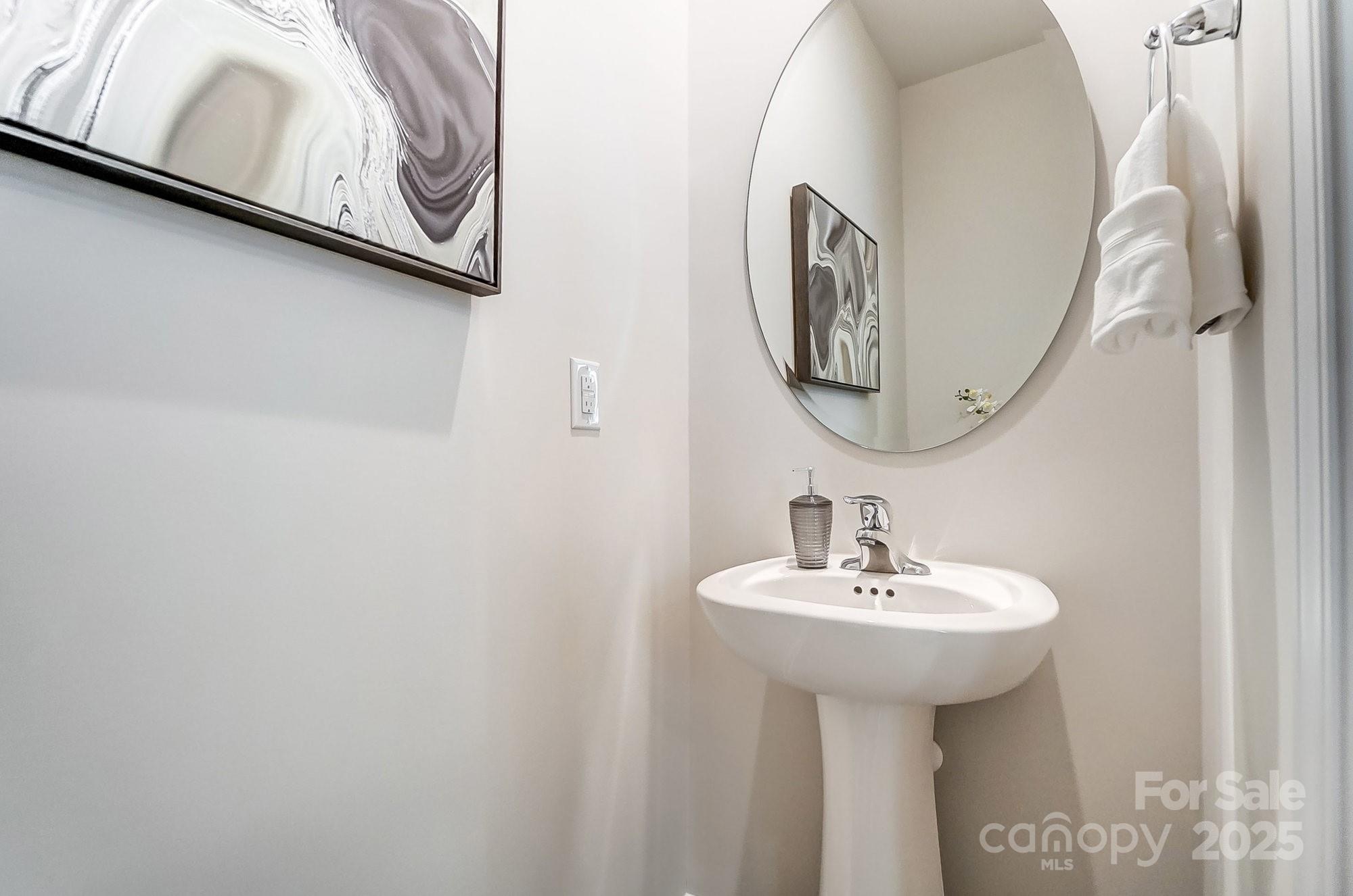311 Laura Elizabeth Lane Clover, SC 29710 - Photo 17 of 39 a bathroom with a sink and a mirror