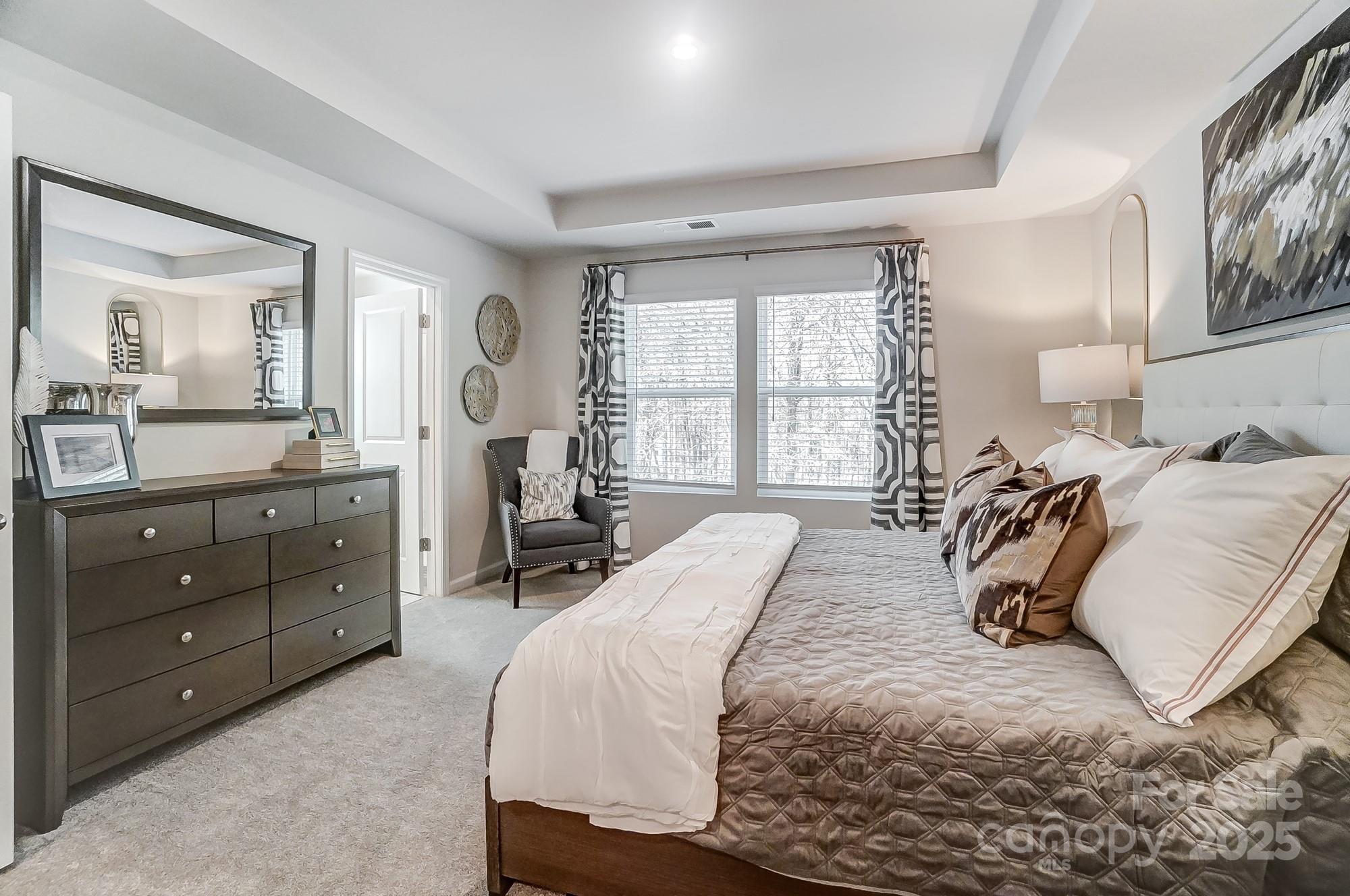 311 Laura Elizabeth Lane Clover, SC 29710 - Photo 21 of 39 a bedroom with a bed and large windows