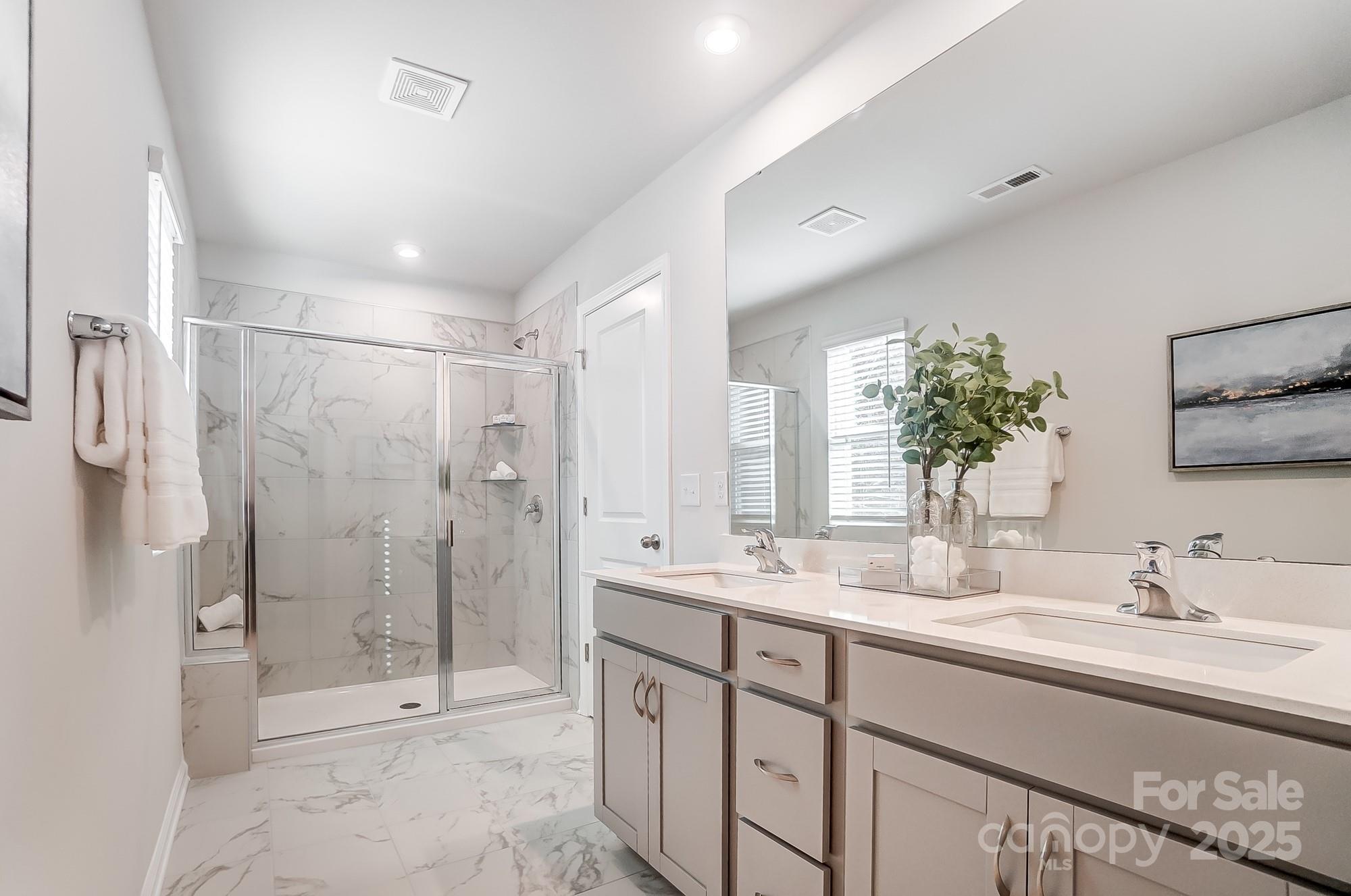 311 Laura Elizabeth Lane Clover, SC 29710 - Photo 26 of 39 a bathroom with a double vanity sink mirror double and shower