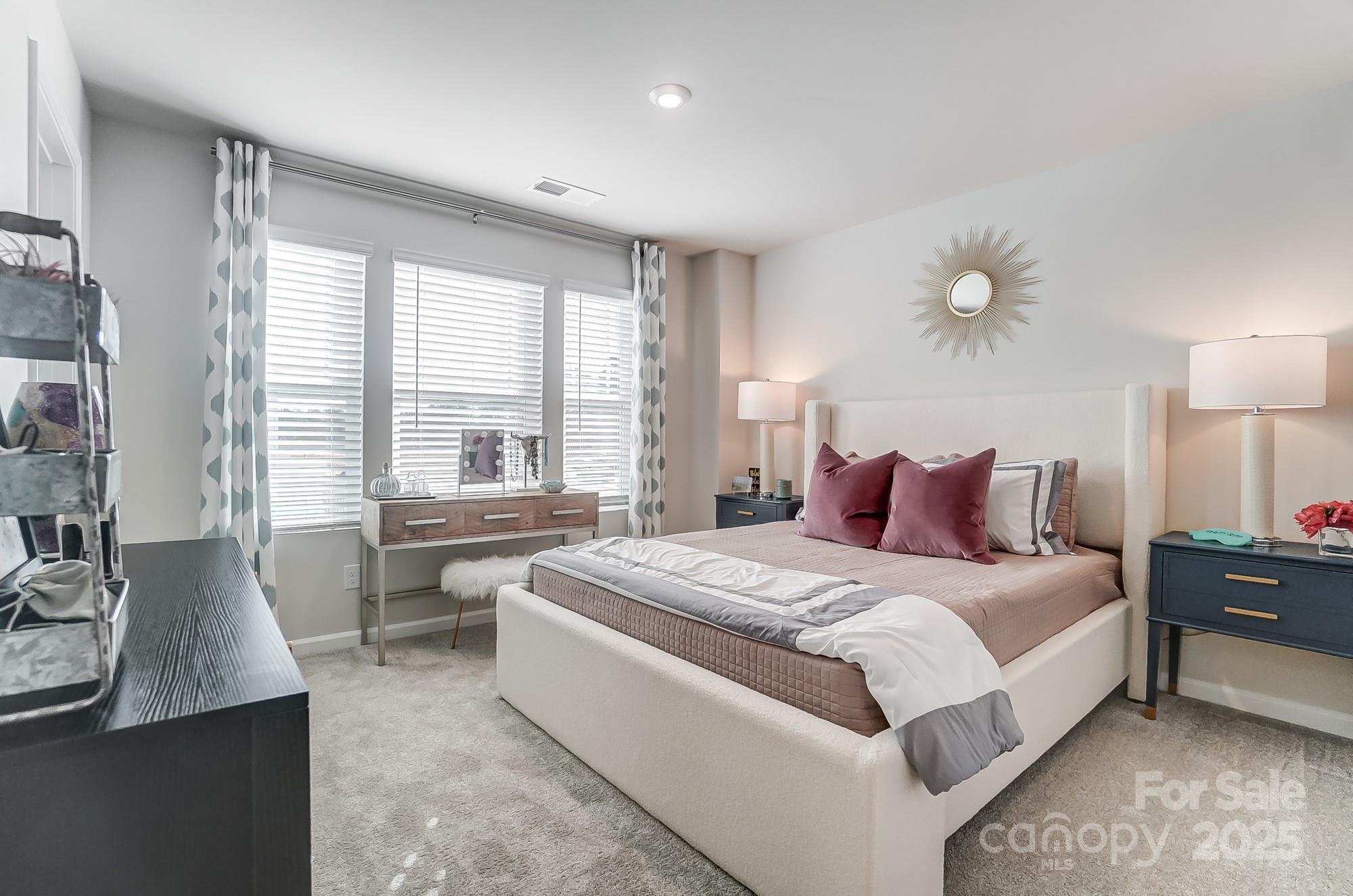 311 Laura Elizabeth Lane Clover, SC 29710 - Photo 31 of 39 a spacious bedroom with a bed and glass windows