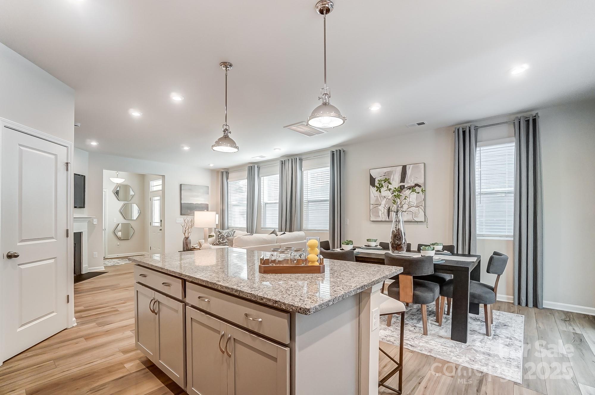 311 Laura Elizabeth Lane Clover, SC 29710 - Photo 10 of 39 a open kitchen with stainless steel appliances granite countertop a sink stove and refrigerator
