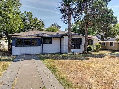 2716 29th Street Lubbock, TX 79410 - Photo 2 of 27 a front view of a house with a yard and garage