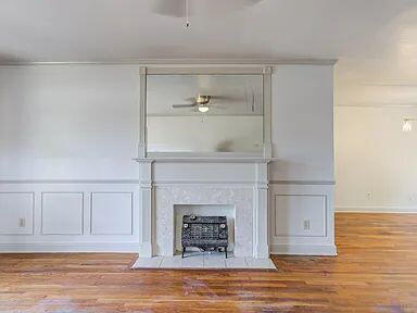 2716 29th Street Lubbock, TX 79410 - Photo 5 of 27 a living room with furniture and a fireplace