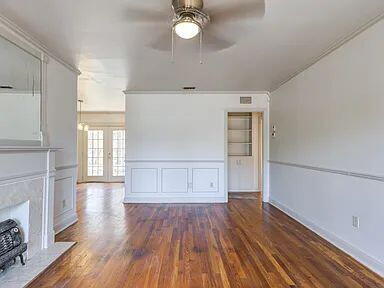 2716 29th Street Lubbock, TX 79410 - Photo 8 of 27 a view of empty room with wooden floor and fan