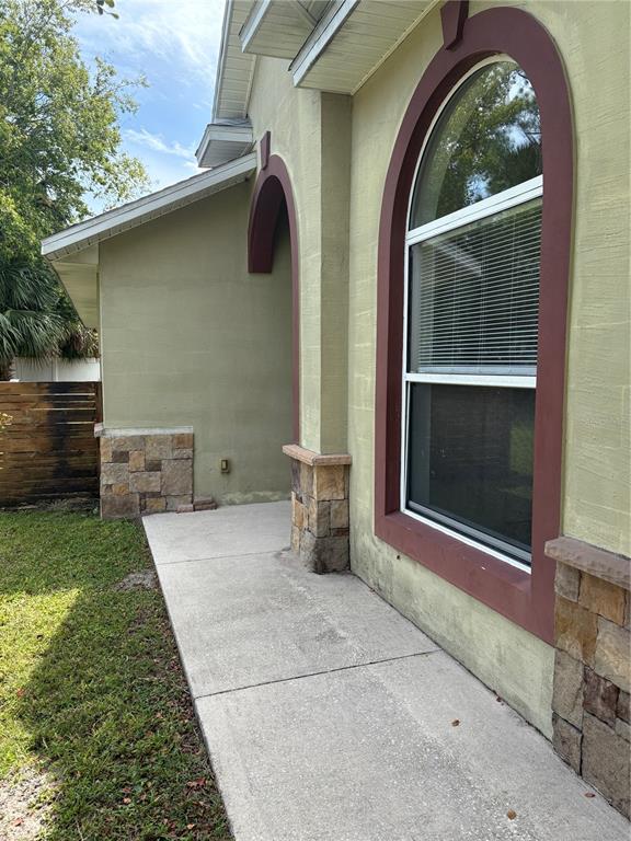 26 Prosperity Lane, Unit A Palm Coast, FL 32164 - Photo 2 of 15 a front view of a house with garden
