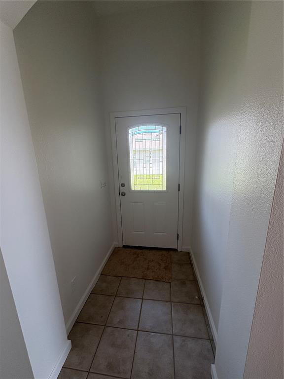 26 Prosperity Lane, Unit A Palm Coast, FL 32164 - Photo 8 of 15 an empty room with windows