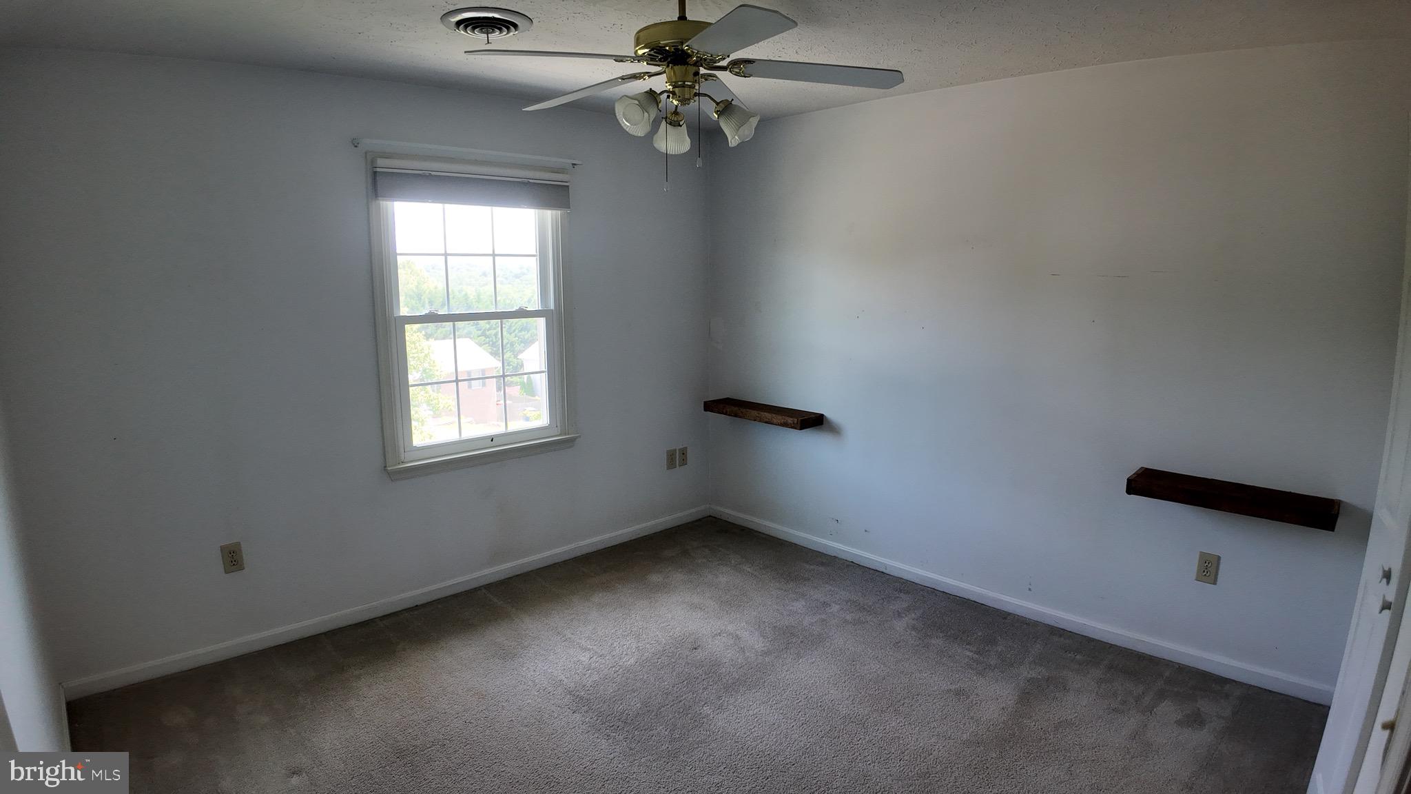 1185 Kesler Road Front Royal, VA 22630 - Photo 33 of 51 an empty room with windows and fan