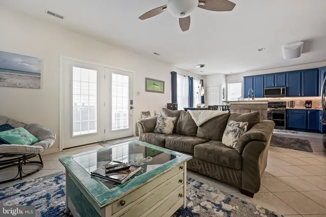 a kitchen with a table chairs and a refrigerator