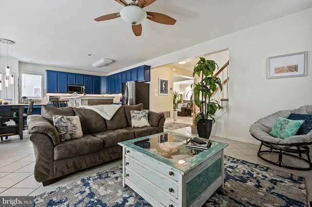 a kitchen with stainless steel appliances granite countertop a stove a sink dishwasher and cabinets with wooden floor