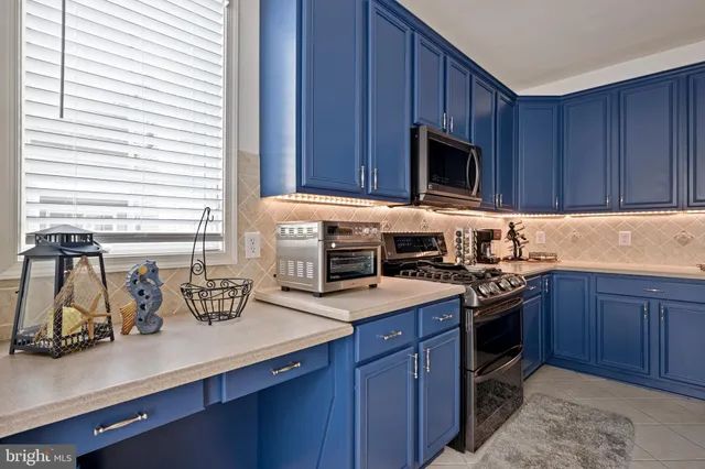 a spacious bedroom with a bed and a couch