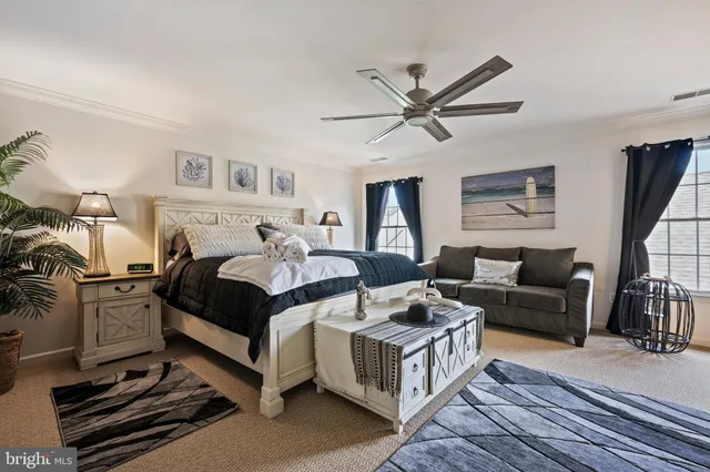 a bed room with a bed and a chandelier