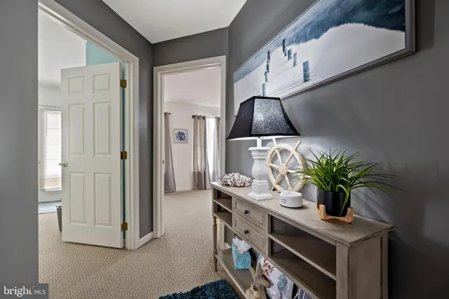 a bed room with a bed and a chair