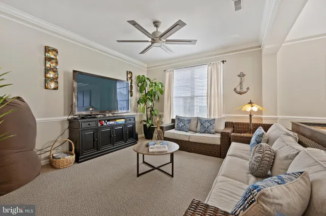 a view of a livingroom with furniture and a window