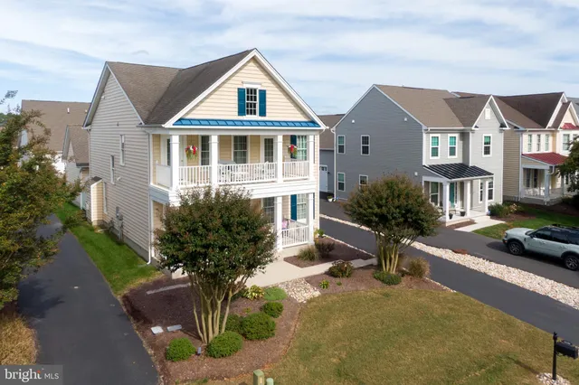 a view of a patio with chairs and a table
