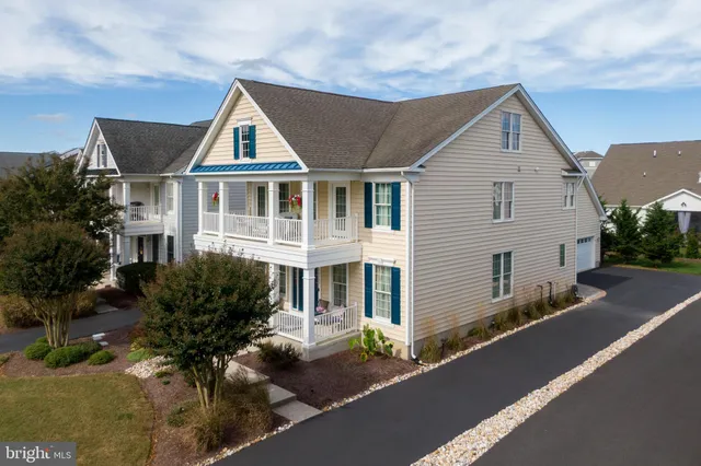 a balcony with furniture and a potted plant