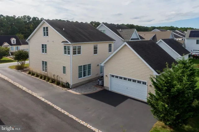 an aerial view of a house with a ocean view