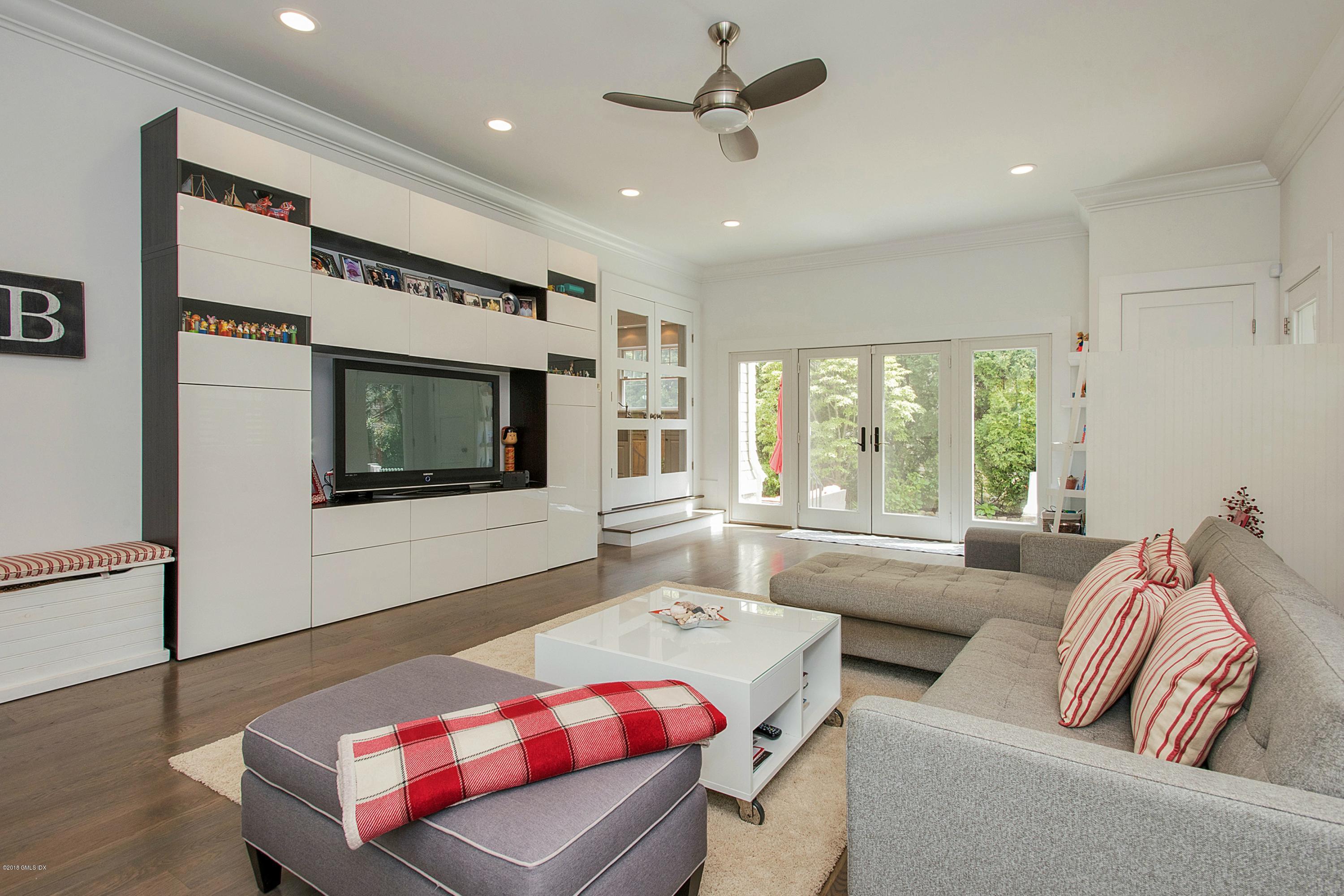 246 Riverside Avenue Riverside, CT 06878 - Photo 13 of 36 a living room with furniture and a flat screen tv