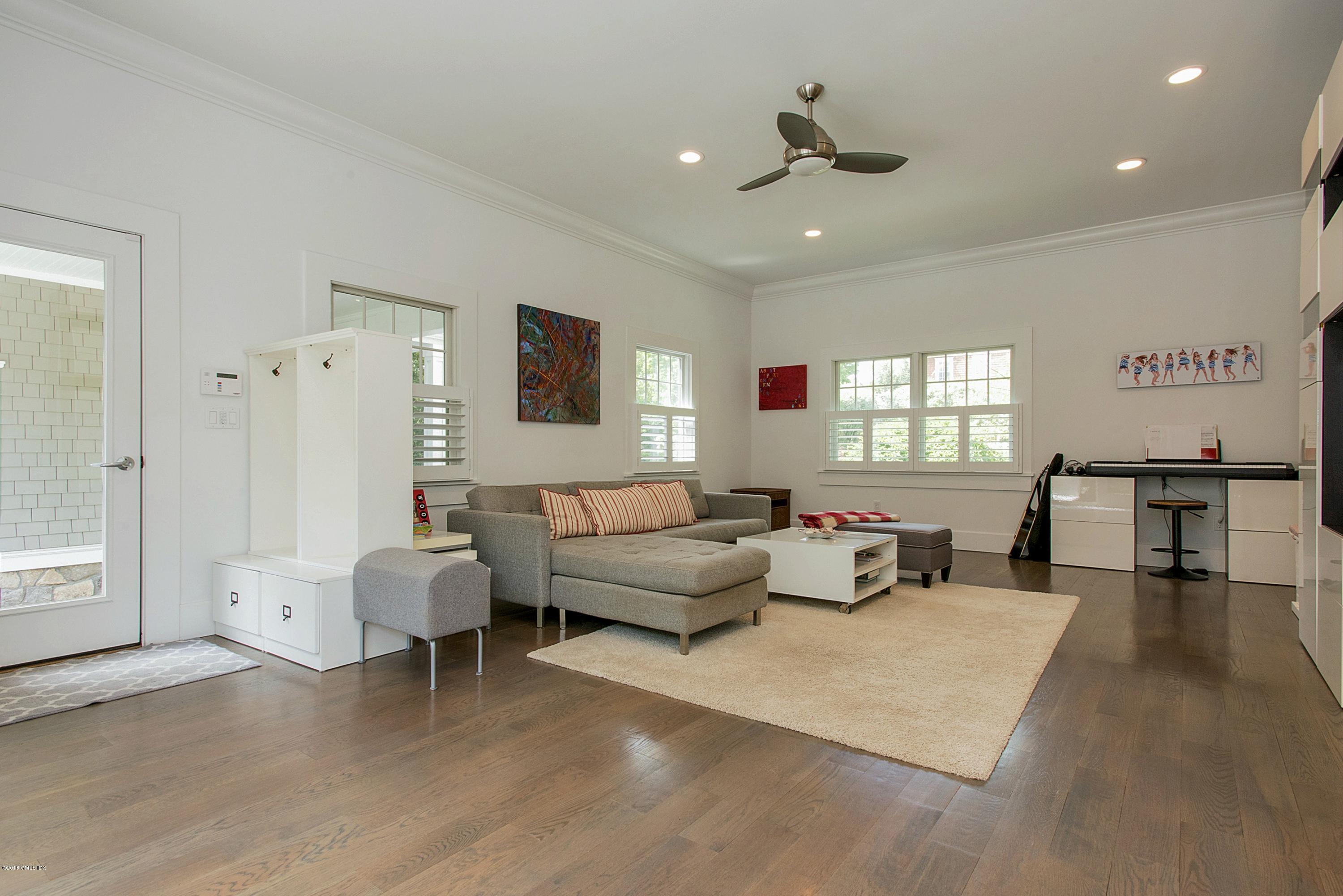 246 Riverside Avenue Riverside, CT 06878 - Photo 14 of 36 a living room with furniture and a large window