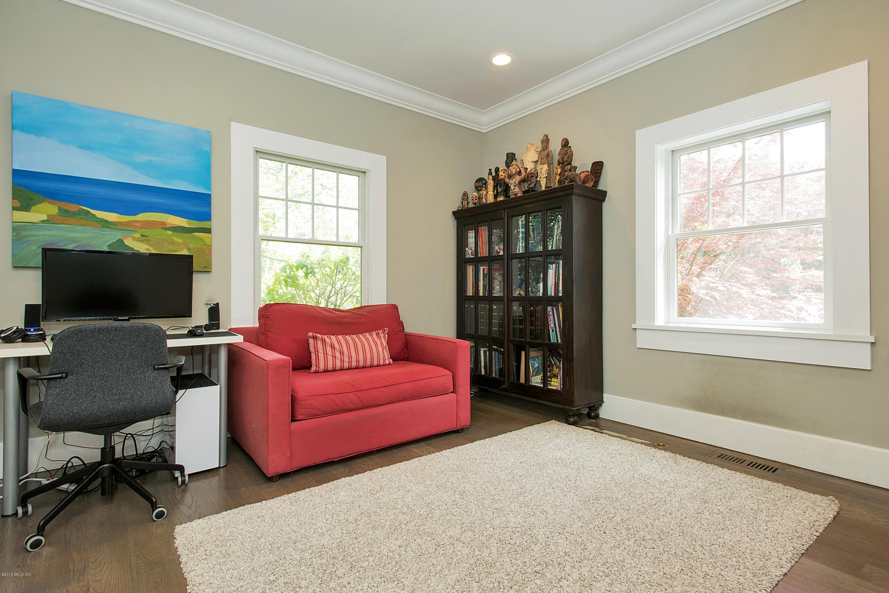 246 Riverside Avenue Riverside, CT 06878 - Photo 15 of 36 a living room with furniture and a flat screen tv