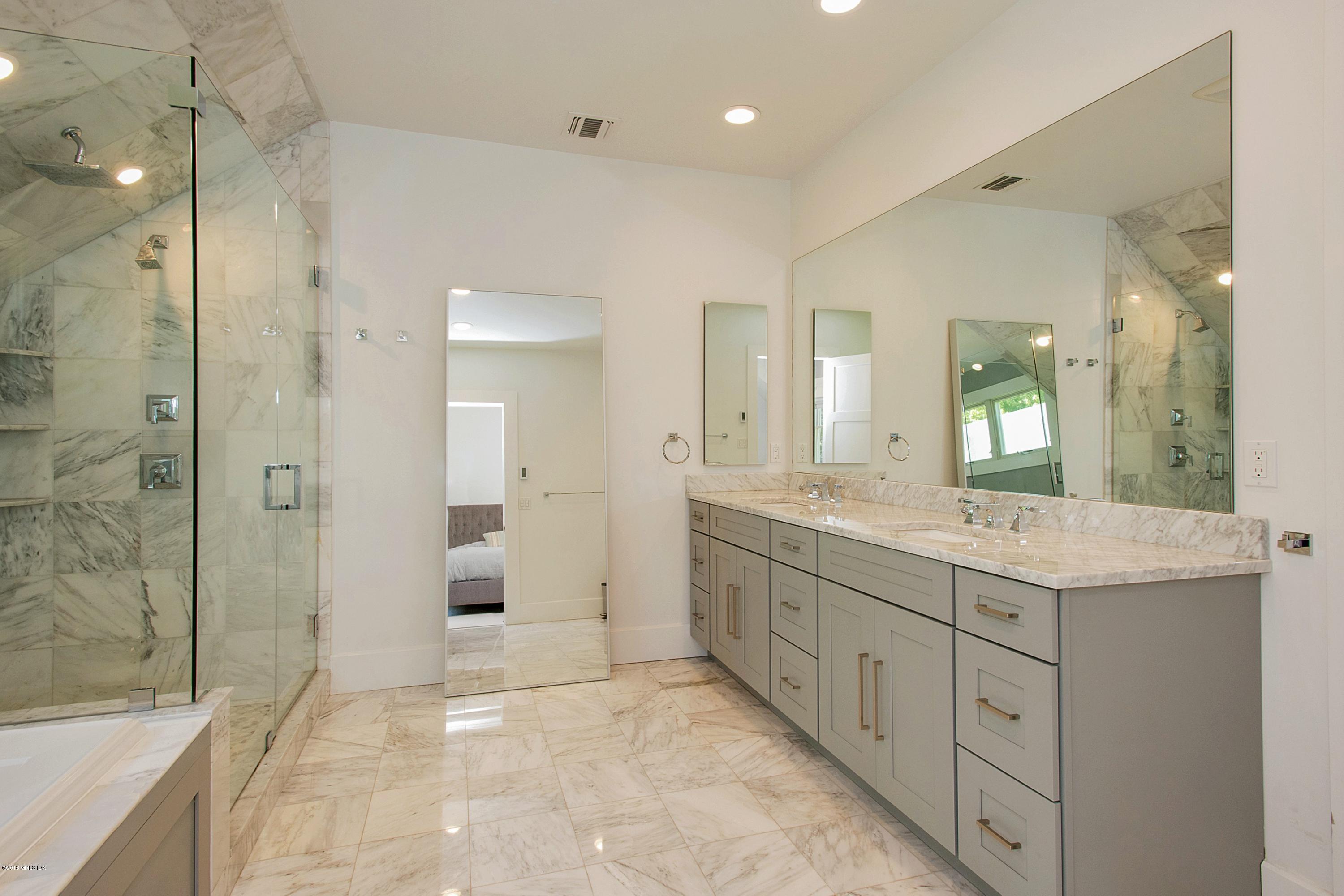 246 Riverside Avenue Riverside, CT 06878 - Photo 19 of 36 a bathroom with a granite countertop sink mirror and shower