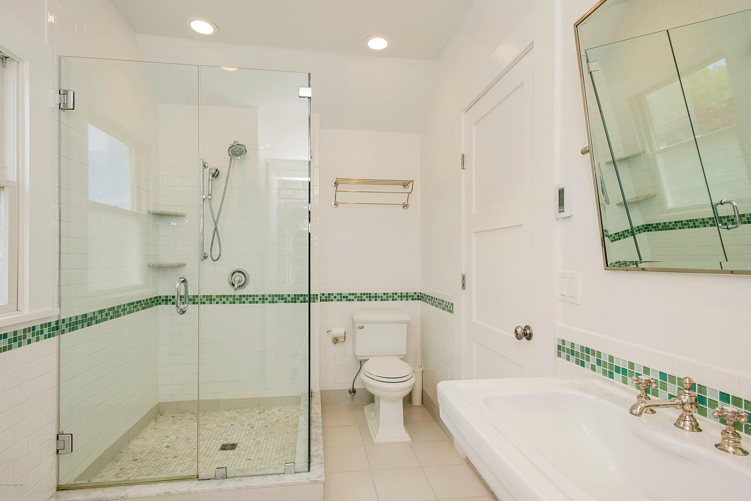 246 Riverside Avenue Riverside, CT 06878 - Photo 22 of 36 a bathroom with a shower and a sink