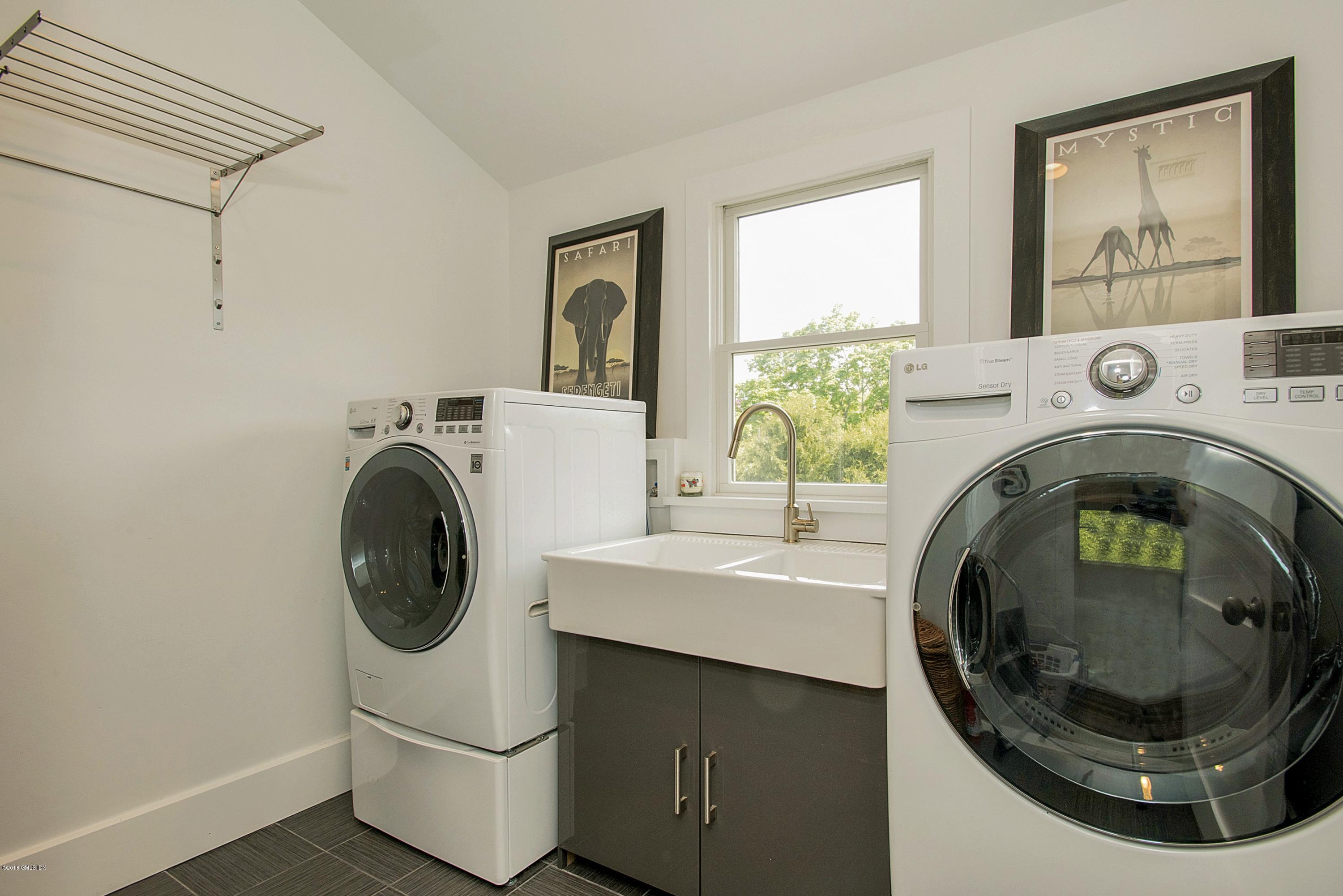 246 Riverside Avenue Riverside, CT 06878 - Photo 24 of 36 a utility room with dryer and washer