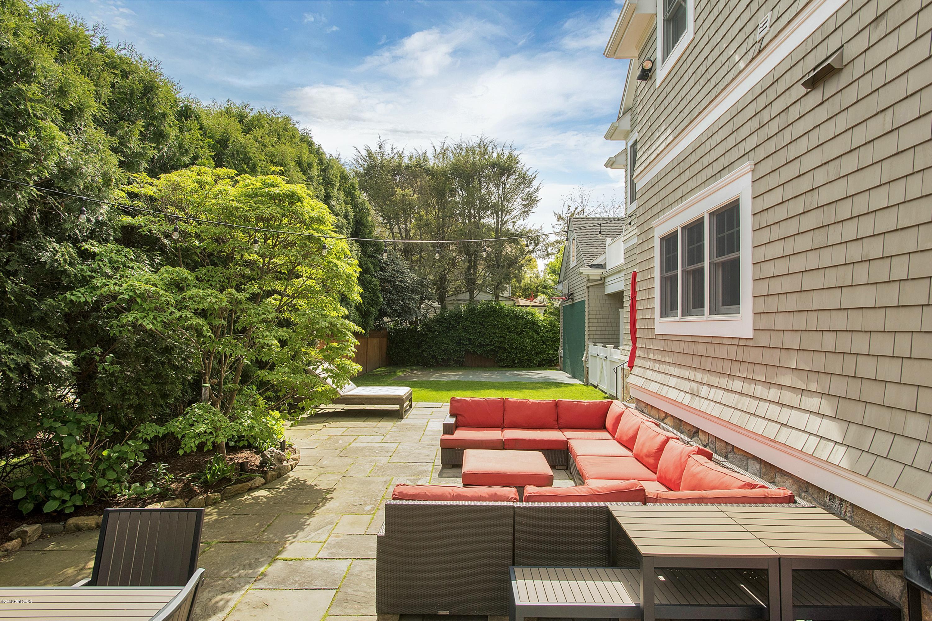 246 Riverside Avenue Riverside, CT 06878 - Photo 26 of 36 a view of a patio with table and chairs and potted plants
