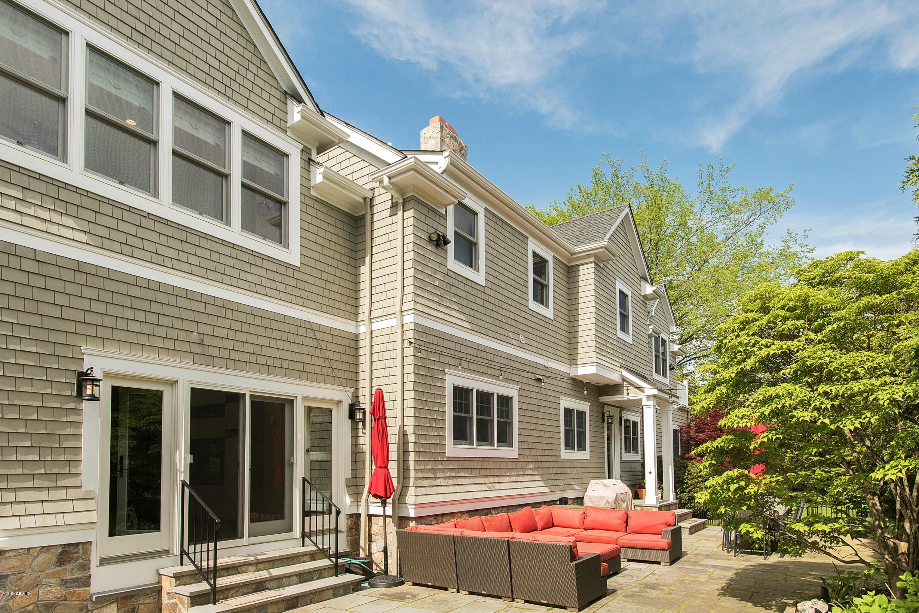 246 Riverside Avenue Riverside, CT 06878 - Photo 28 of 36 front view of a house with a yard