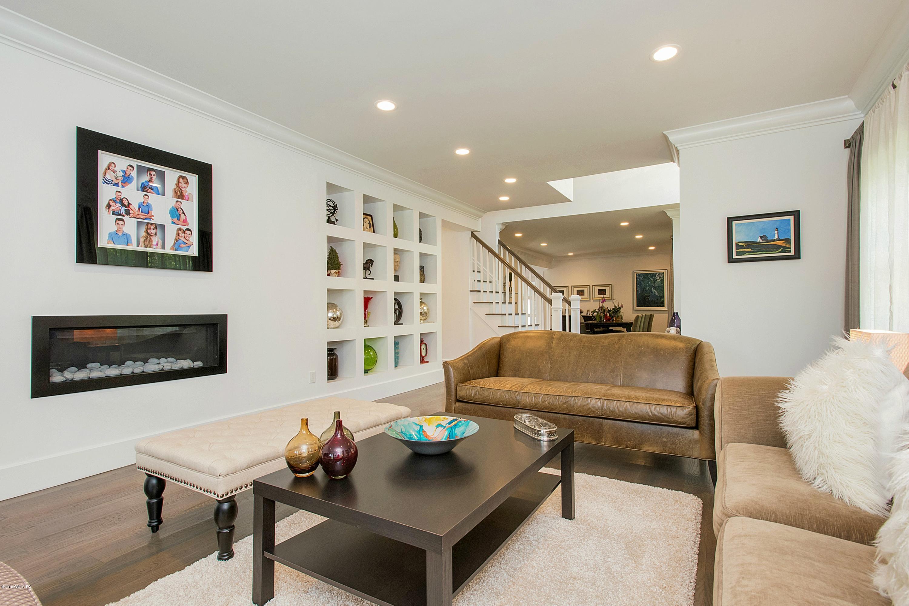 246 Riverside Avenue Riverside, CT 06878 - Photo 6 of 36 a living room with furniture and a wall painting